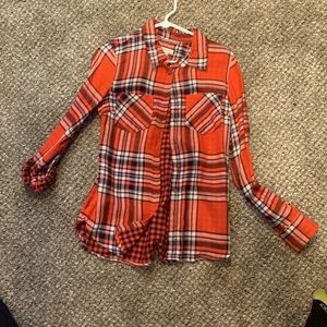 Red flannel with red and black checker reversible button up. SIZE XS.